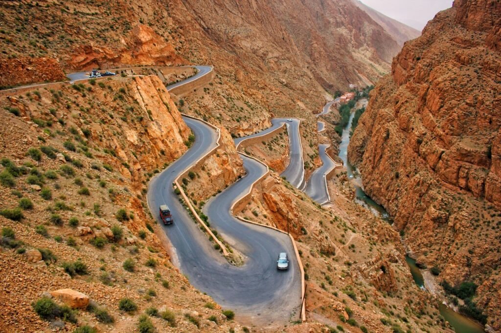 cenic hairpin turns of Dades Gorge in the Atlas Mountains of Morocco, surrounded by red rock cliffs