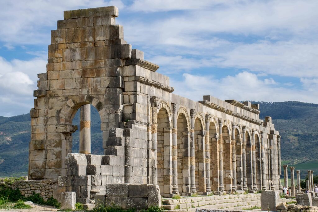 Ancient Roman arches and ruins at Volubilis archaeological site near Meknes, Morocco